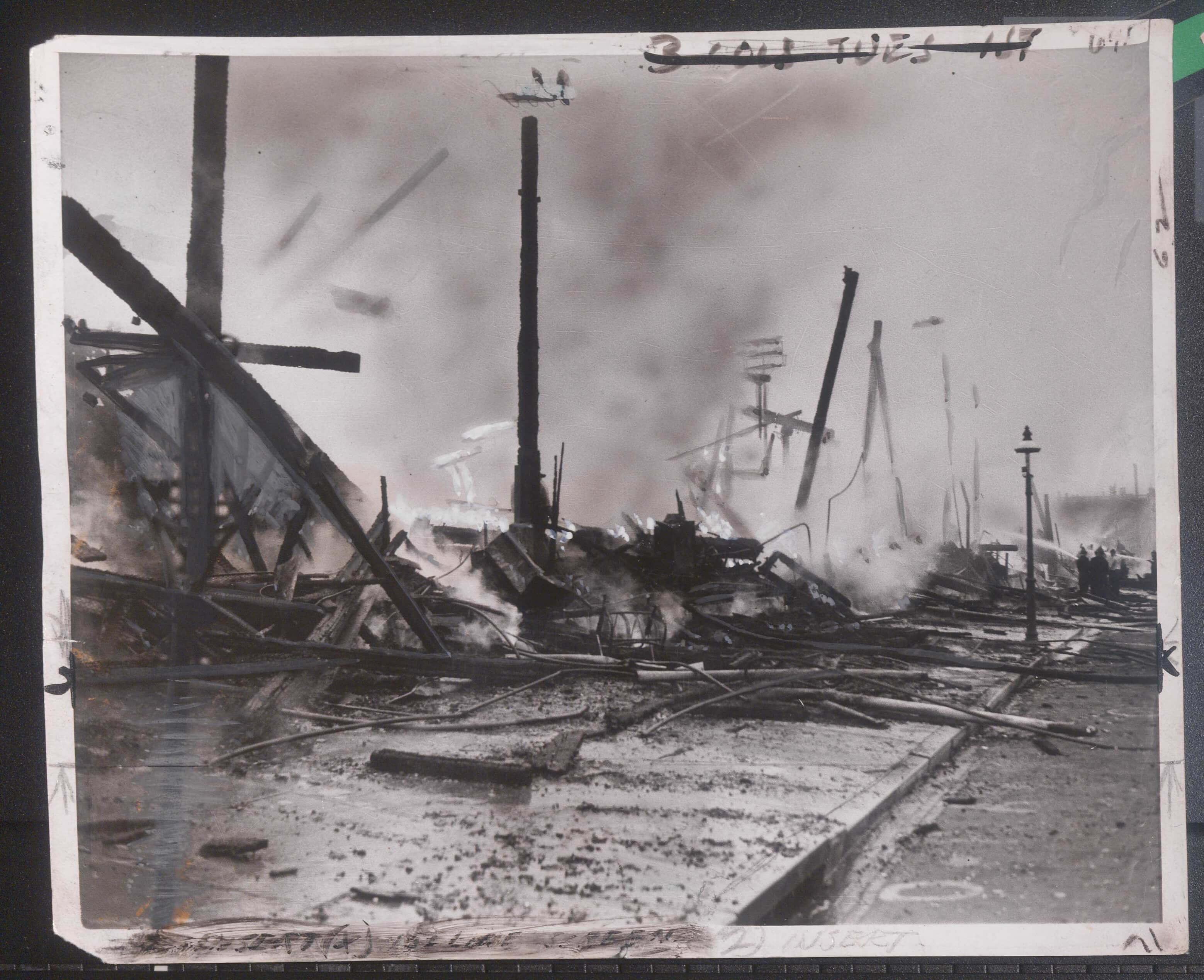 Firefighters spraying water over the burned wreckage of Oriole Park