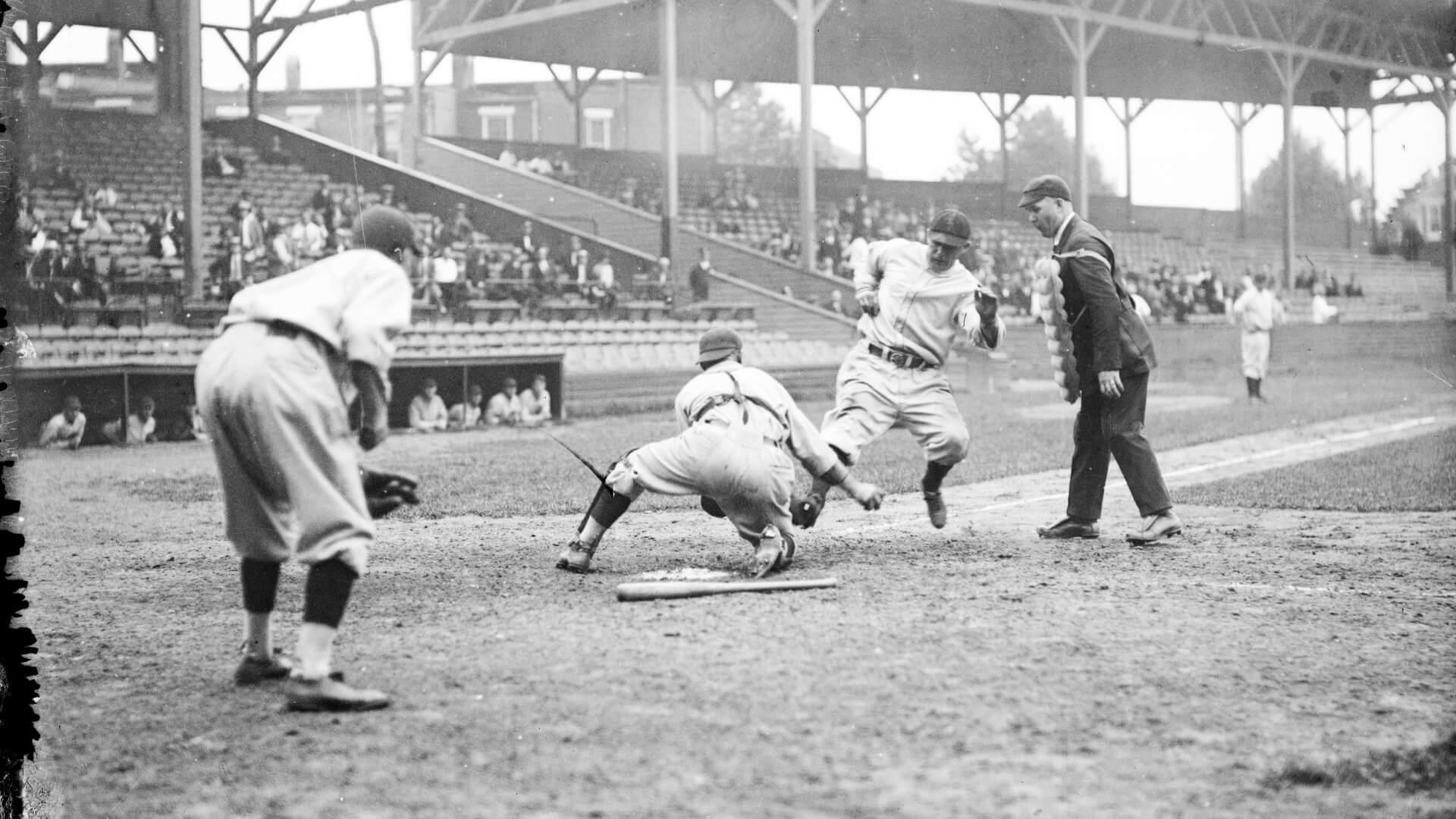 Black and white photo of Fredrick Fritz Maisel at Old Oriole Park at home plate