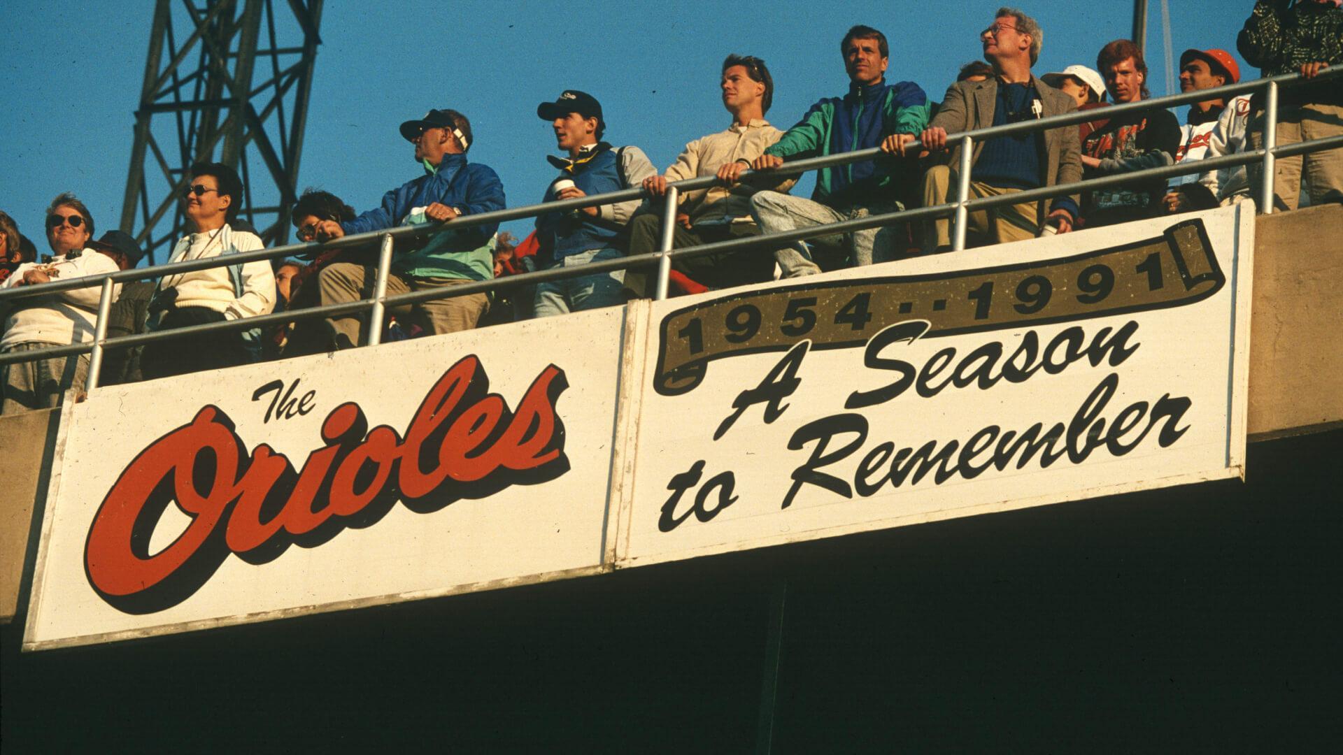 The lower to upper deck at Memorial Stadium with a banner that says, "A Season to Remember"