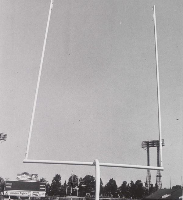 Football goalposts on the field at Baltimore’s Memorial Stadium with empty stands in the 1960s.